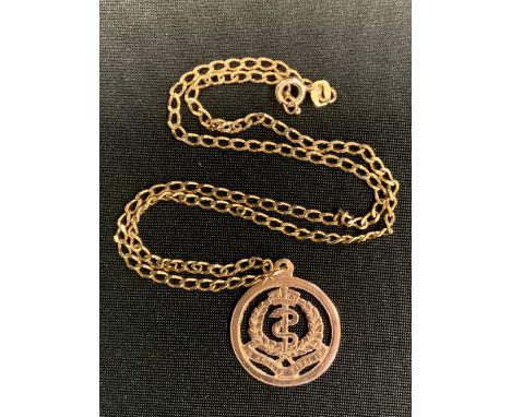 An Army Medical Corp 9ct gold pendant, stamped 9ct, suspended from a later curb link necklace, stamped 375, 7.6g gross 