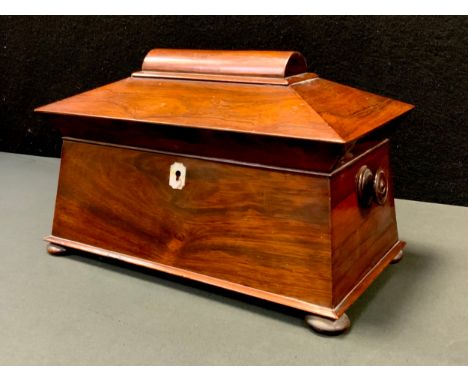 A Victorian Rosewood sarcophagus tea caddy, twin lidded removable compartments, mixing bowl aperture, turned handles, bun fee