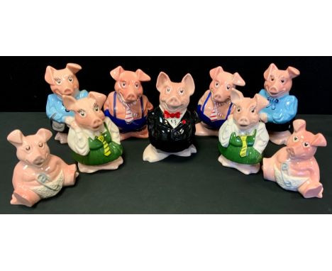 A Family of Wade Nat West Pig money banks, Sir Nathaniel, Lady Annabel etc, some duplicates (9) 