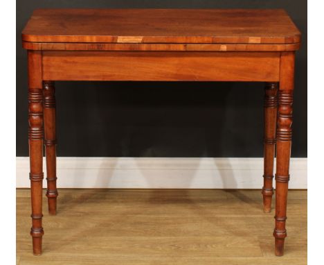 A 19th century mahogany card table, hinged top enclosing a baize lined playing surface, ring-turned legs, 72.5cm high, 86.5cm