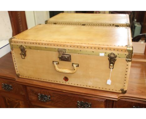 A vintage cream parchment travelling trunk