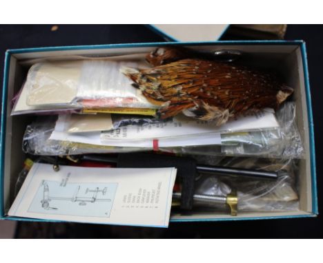 Two boxes containing fly tying tools and materials.