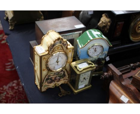 A Smiths Enfield oak mantle clock with an eight day movement, together with a Victorian brass carriage clock and two further 
