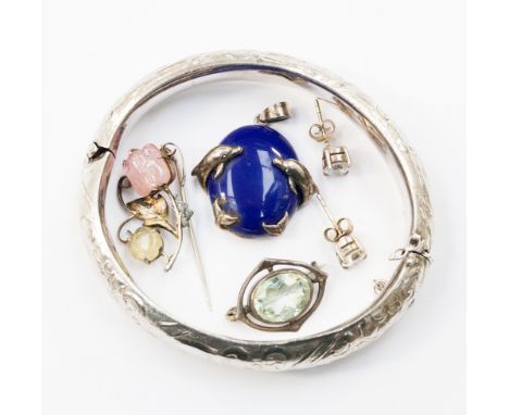 A white metal bangle marked .835, a blue stone pendant in .925 dolphin setting, a small sterling silver and quartz Art Nouvea