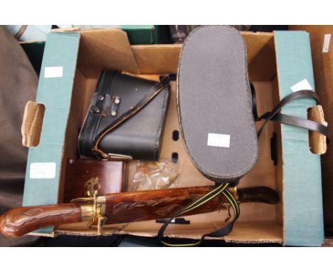 A cased pair of Prinz binoculars, with a pair of cased Hiranda binoculars, two axe heads, etc.
