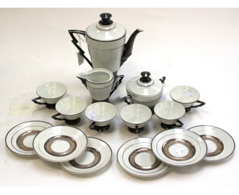 A Czechoslovakian Art Deco silver overlaid coffee set, including coffee pot, six cups and six saucers, sugar bowl and milk ju