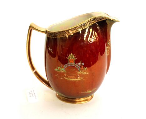 A Carltonware Rouge Royale jug with gilt design.