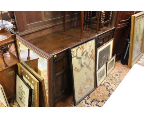 An Ercol solid oak sideboard fitted with two doors and four drawers.