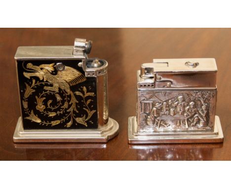 A Continental silver table lighter depicting a tavern scene, stamped 800, together with vintage Rowenta cigarette table light