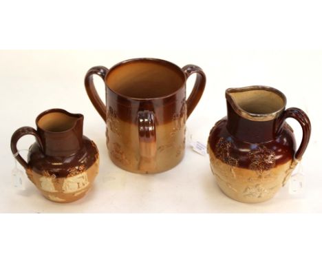 A Doulton Lambeth treacle glaze tyg with applied hunting scene and country gentleman decoration, together with a Doulton Lamb