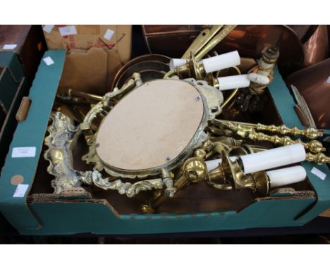 A box of assorted brassware comprising coal forks, poker, fire dogs, table mirror, three graduated pans, light fittings, etc.