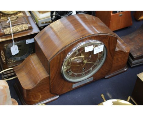 A 1930's mantel clock with Rolls Royce presentation inscription, together with one other mantel clock (2)