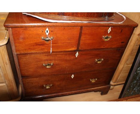 A George III oak mahogany chest of drawers, fitted with two short over two long graduated drawers, raised on bracket feet