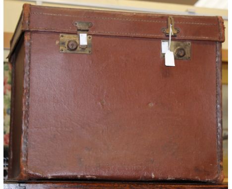An early 20th Century leather cube shaped trunk