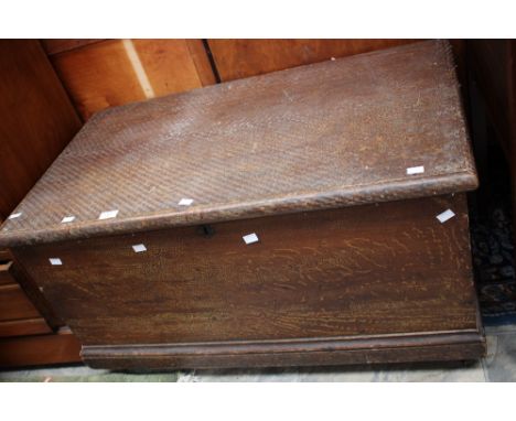 A 19th Century lidded trunk.