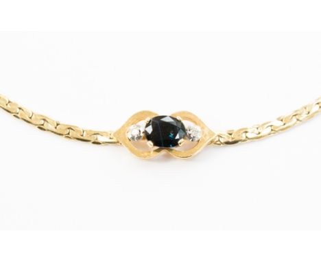 A 9ct flat link bracelet, claw set; oval sapphire and two diamonds, approximately 5 grams.