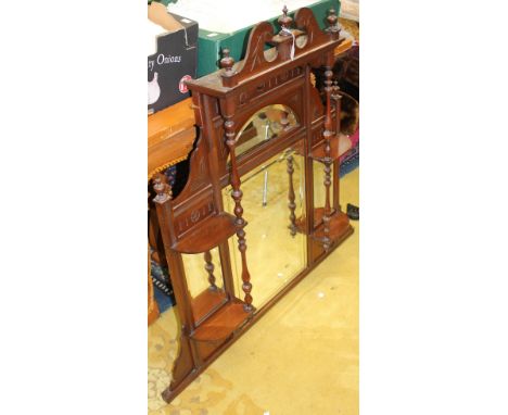 A Late Victorian Aesthetic mahogany over-mantle mirror, the projecting top with a swan neck pediment over a sectioned mirrore