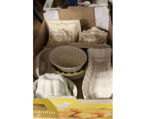 A collection of ceramic jelly moulds, together with a pair of Archway features and fish moulds. (7)