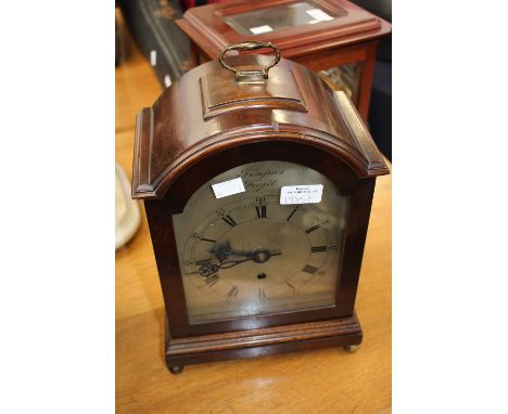 A wooden mantle clock