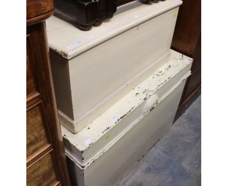 A white painted metal lidded chest, together with a white painted wooden travelling trunk. (2)