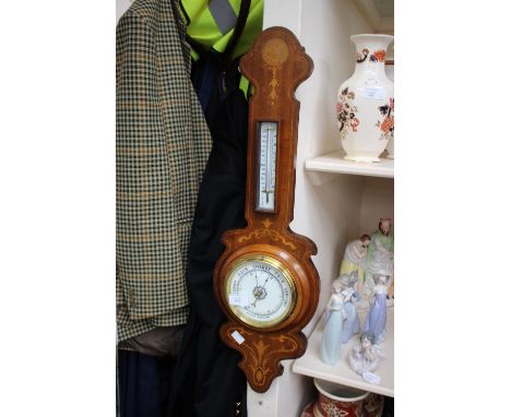 An Edwardian inlaid aneroid barometer.