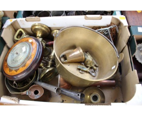 A collection of brassware including a pair of early 19th Century brass candlesticks, a single candlestick, brass weights, jam