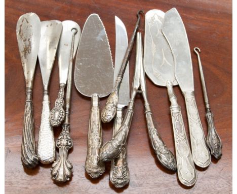 A collection of sterling silver handled glove stretchers, button hooks, cake servers and a Continental 800 standard cake serv
