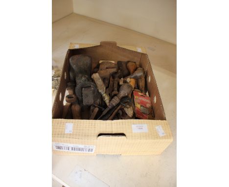 A box of assorted tools comprising, screwdrivers, a cross cut saw, spanners, knives, etc.