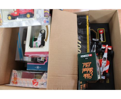 A box of boxed diecast including Corgi Eddie Stobart, Minichamps, Solido, approximately fifteen.