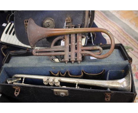 A Broadway trumpet in case, together with a circa 1910 bugle and case. (2)