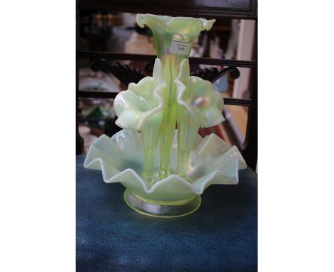 A Luster Vaseline glass epergne, having four flower holders standing in a bowl with deeply fluted edges 