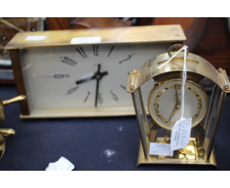 An eight day wind up mantle clock, and a 1970's wind up mantle square clock. (2)