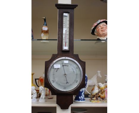 An Art Deco oak cased barometer and thermometer, by W. Evans & Son, Matlock