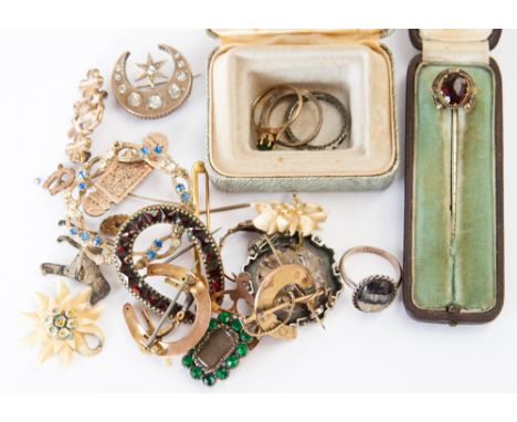 A 19th Century mourning brooch containing hair plait and set green stones, together with eight further rings, stick pins, etc