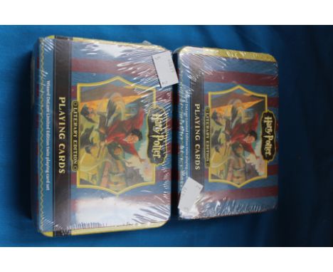 Two sets of Ltd Edition Harry Potter playing cards in unopened tins.