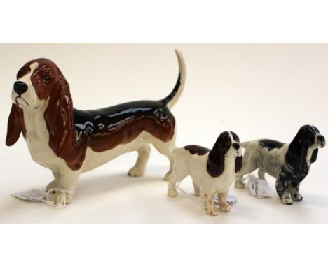 A Beswick Bassett Hound 'Foncho Trinket' Model No 2045A, together with two Beswick Cocker Spaniels, model no 1754, black and 