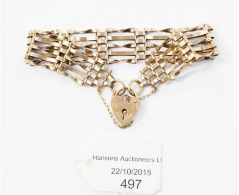 A 9ct gold gate bracelet with padlock clasp.