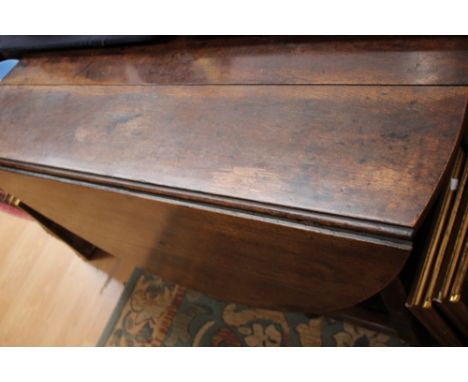 A late 17th Century oak gateleg table, fitted with a single drawer, raised on barrel and ring turned legs, joined by square m