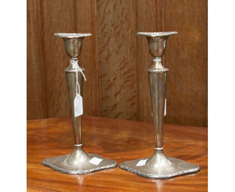 A pair of silver weighted candlesticks, William Hutton, Sheffield 1918 