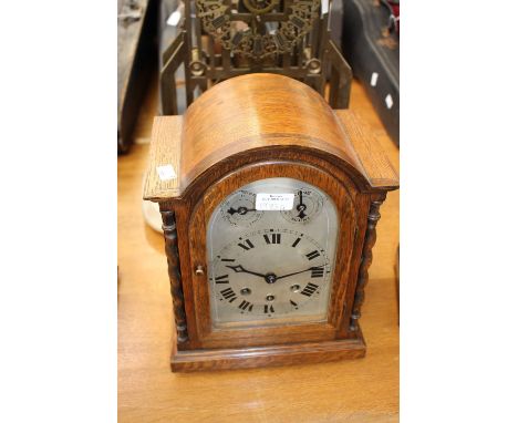 A wooden German mantle clock.
