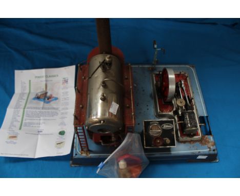 A Wilesco D24 Stationary Engine, Live Steam, working order, some surface rust, with accessories.