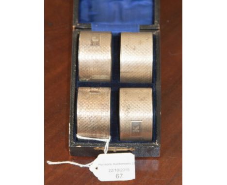 A boxed set of silver napkin rings, Chester 1946, with engine turned decoration, complete with original presentation box, 127