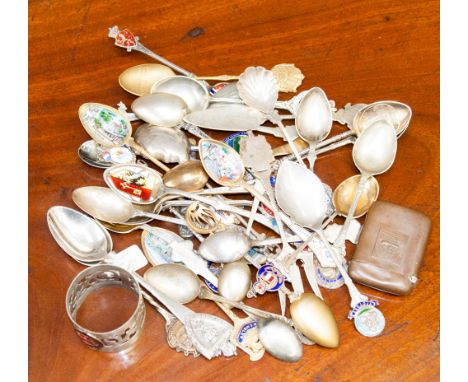 A collection of silver plated wares to include souvenir teaspoons, some with enamelled terminals, a copper vesta case made of