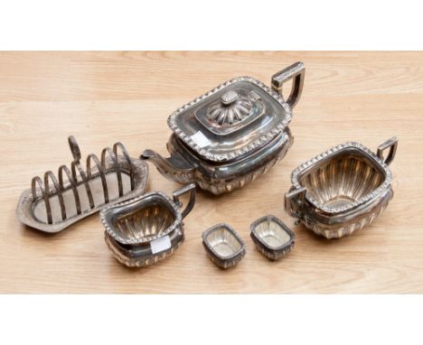 A pair of late Victorian silver salt cellars, Chester 1900, with gadrooned bodies, plus a matching silver plated three piece 