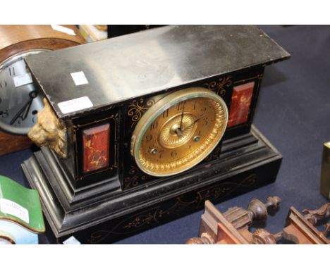 A late 19th Century black lacquer mantle clock, gilt dial.