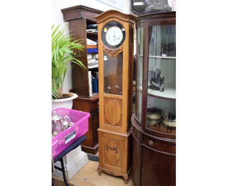 A Kieninger German longcase clock, with a white dial, having an eight day movement