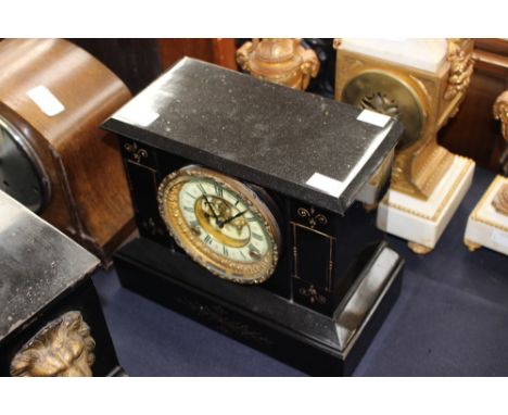 A Victorian black slate mantle clock, with an eight day movement, the white enamelled chapter dial with two winder holes, com