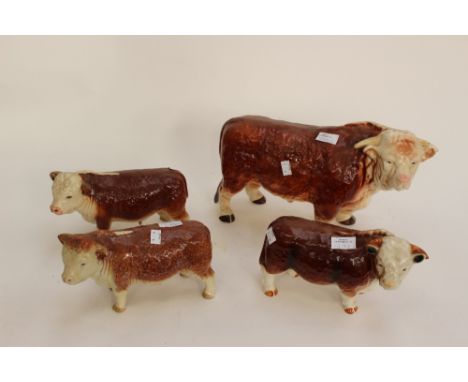Four ceramic figures of bulls, Charolais, some marked Coopercraft and Melba Ware.