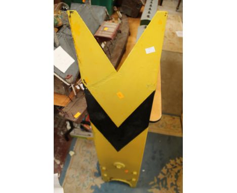 A signal arm, yellow / black to front with mounting bracket to rear