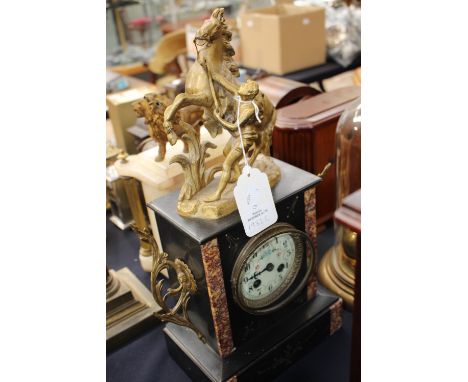 A French marble and gilt metal table/mantle clock with a cast model of Hercules and rearing horse atop, 19th Century.